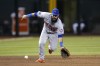 FILE - New York Mets third baseman Luis Guillorme fields a grounder hit by Arizona Diamondbacks' Gabriel Moreno, who was out at first during the eighth inning of a baseball game July 6, 2023, in Phoenix. The Atlanta Braves added depth to their bench Friday, Jan. 5, by signing Guillorme to a $1.1 million, one-year deal. Guillorme, 29, spent the last six seasons with the Mets, playing second base, shortstop and third base. (AP Photo/Ross D. Franklin, File)