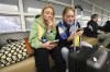 College students Fiona Max, left, and her twin sister Isabel Max check their phones while trying to rebook their flight back to school at Princeton after their Alaska Airlines flight was canceled at Seattle-Tacoma International Airport on Saturday, Jan. 6, 2024, in SeaTac, Wash. Alaska Airlines canceled more than 100 flights after grounding Boeing's fleet of 65 Max 9s for inspections following Friday's emergency landing of a Boeing 737 Max 9 jetliner. (Karen Ducey/The Seattle Times via AP)