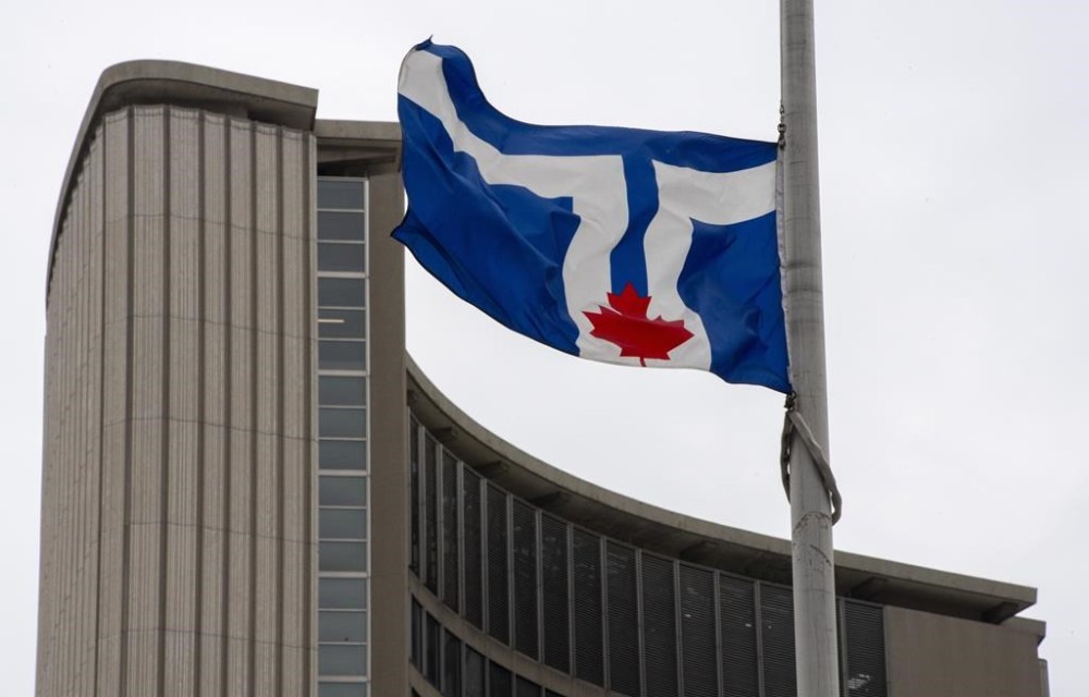 The City of Toronto says one of its construction crews found 'ancient' human remains from an Indigenous burial ground on Friday. The city of Toronto flag flies at City Hall in Toronto on Friday, April 9, 2021. THE CANADIAN PRESS/Frank Gunn