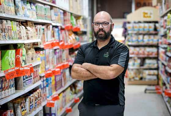 “A lot of the theft that we have here is not opportunity, it’s people that are hungry,” said Kevin Schmidt, co-owner of Downtown Family Foods. (John Woods / Winnipeg Free Press)