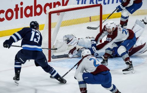 Winnipeg Jets' Gabriel Vilardi (13) scores against Colorado Avalanche goaltender Ivan Prosvetov (50) as Ross Colton (20) and Logan O'Connor (25) defend during first period NHL action in Winnipeg on Saturday, December 16, 2023. THE CANADIAN PRESS/John Woods