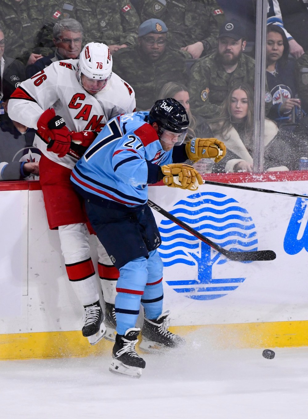 Fred Greenslade / THE CANADIAN PRESS
Carolina Hurricanes' Brady Skjei is checked by Winnipeg Jets' Nikolaj Ehlers during the third period.