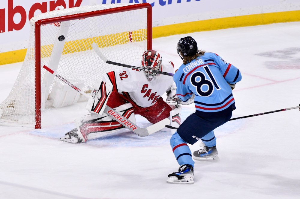Fred Greenslade / THE CANADIAN PRESS
Kyle Connor scores on Carolina Hurricanes goaltender Antti Raanta during the first period.