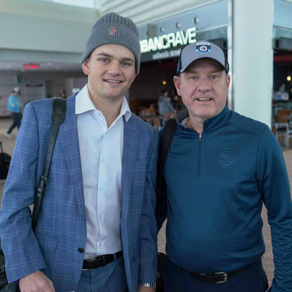 WINNIPEG JETS
Cole Perfetti and his dad, Angelo, at the airport.