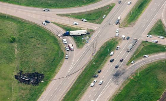 The scene of a fiery collision between a bus and semi-trailer that left 15 seniors dead and 10 seriously injured on the Trans-Canada Highway north of Carberry in June. (Mikaela MacKenzie / Winnipeg Free Press files)