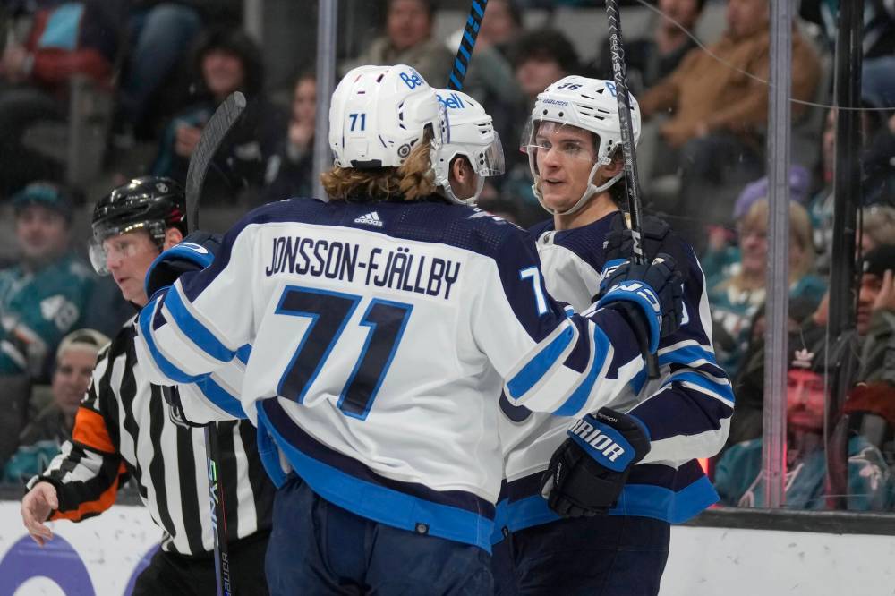JEFF CHIU / ASSOCIATED PRESS FILES Winnipeg Jets’ Morgan Barron, right, with Axel Jonsson-Fjallby and Dominic Toninato.