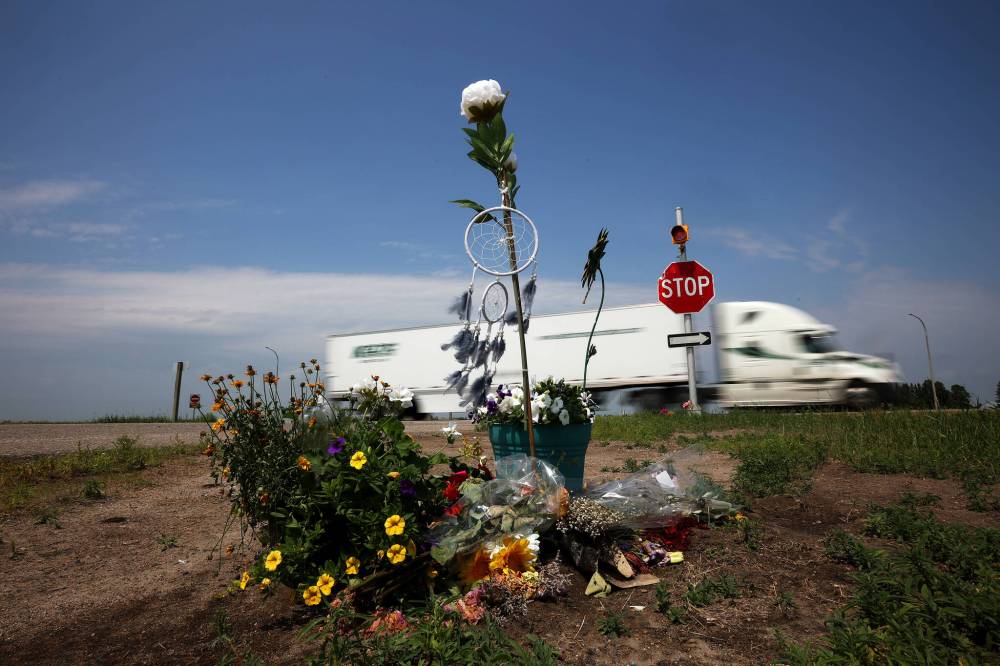 Flowers and other items placed at the intersection of the Trans-Canada Highway and Highway 5 just north of Carberry in June 2023 as a memorial to the victims of a collision involving a semi-trailer and a passenger bus carrying seniors from Dauphin to the Sand Hills Casino. (Tim Smith / The Brandon Sun files)