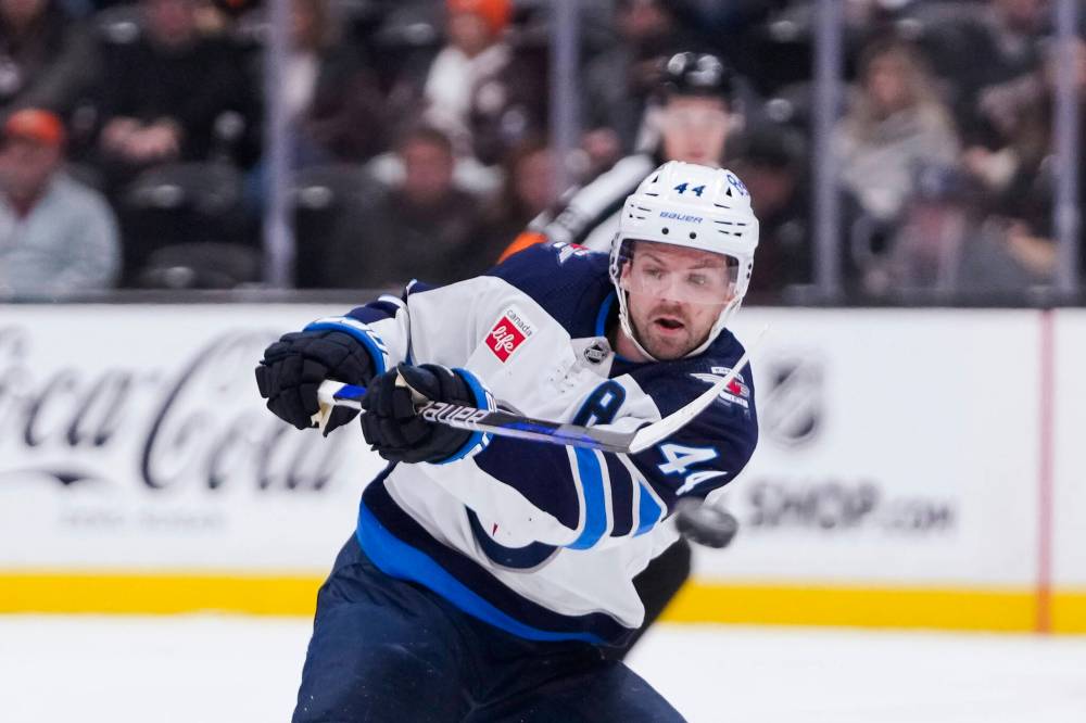 Winnipeg Jets defenceman Josh Morrissey clears the puck during the second period. (AP Photo/Ryan Sun)
