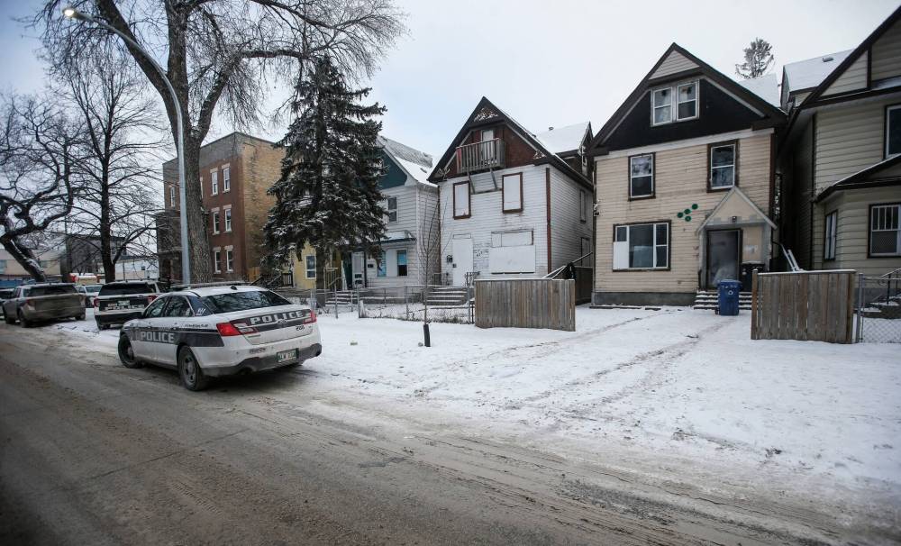 A home at 575 Furby St. was raided by police Saturday night, marking the second time the three-storey house was targeted by police in less than two months. (John Woods / Winnipeg Free Press)
