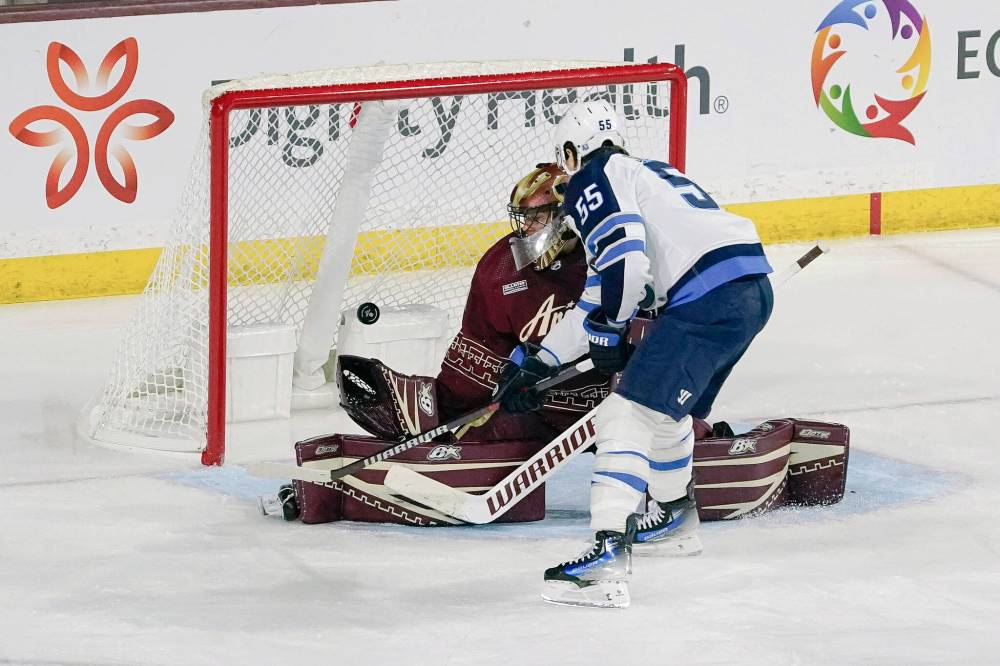 Winnipeg Jets’ Mark Scheifele (55) scores against Arizona Coyotes goalie Karel Vejmelka, left, during the third period of an NHL hockey game Sunday, Jan. 7, 2024, in Tempe, Ariz. (Darryl Webb / The Associated Press)