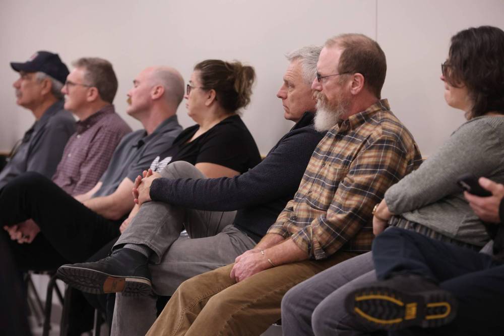 Dauphin Mayor David Bosiak (third from right) listens as Manitoba Premier Wab Kinew speaks during the press conference. (Tim Smith / The Brandon Sun)