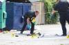 RUTH BONNEVILLE / WINNIPEG FREE PRESS FILES
                                Police investigate the scene of a fatal stabbing at the rear of a convenience store in the 100 block of Salter Street July 28, 2021.