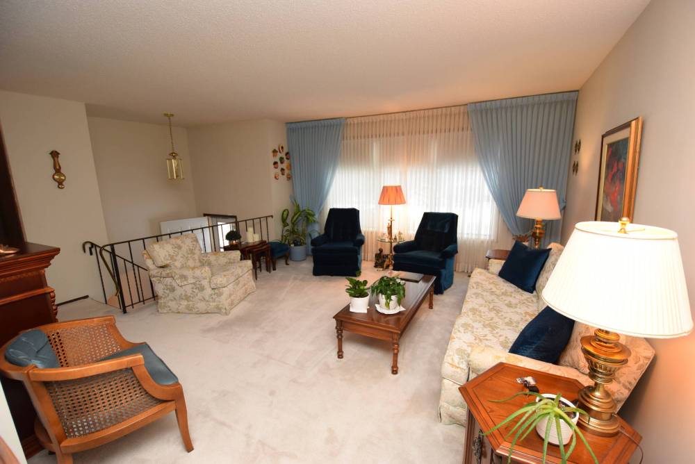 The living room, which is just steps from the dining room, is a great spot to entertain or relax.