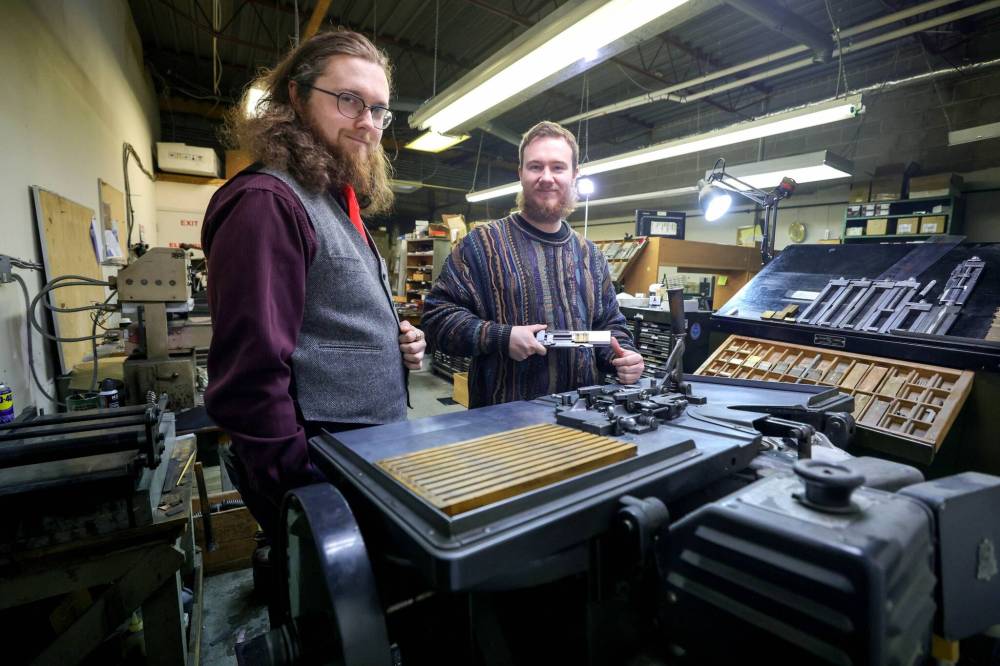 RUTH BONNEVILLE / WINNIPEG FREE PRESS
Willows Christopher and Zach Isaacs, the new owners of Maple Leaf Rubber Stamp, a Manitoba business with a history dating back to 1932.