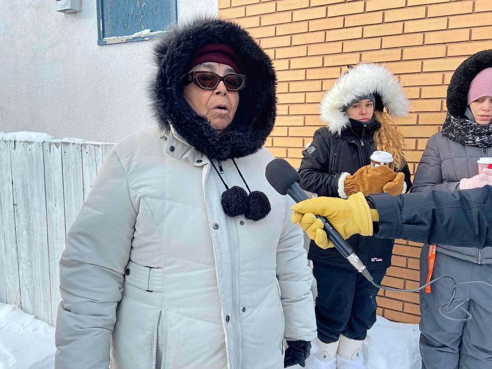 Beverley Courchene, Leah Keeper’s mother, canvassed the North End with volunteers seeking information on her daughter’s disappearance Saturday. (Malak Abas / Winnipeg Free Press)