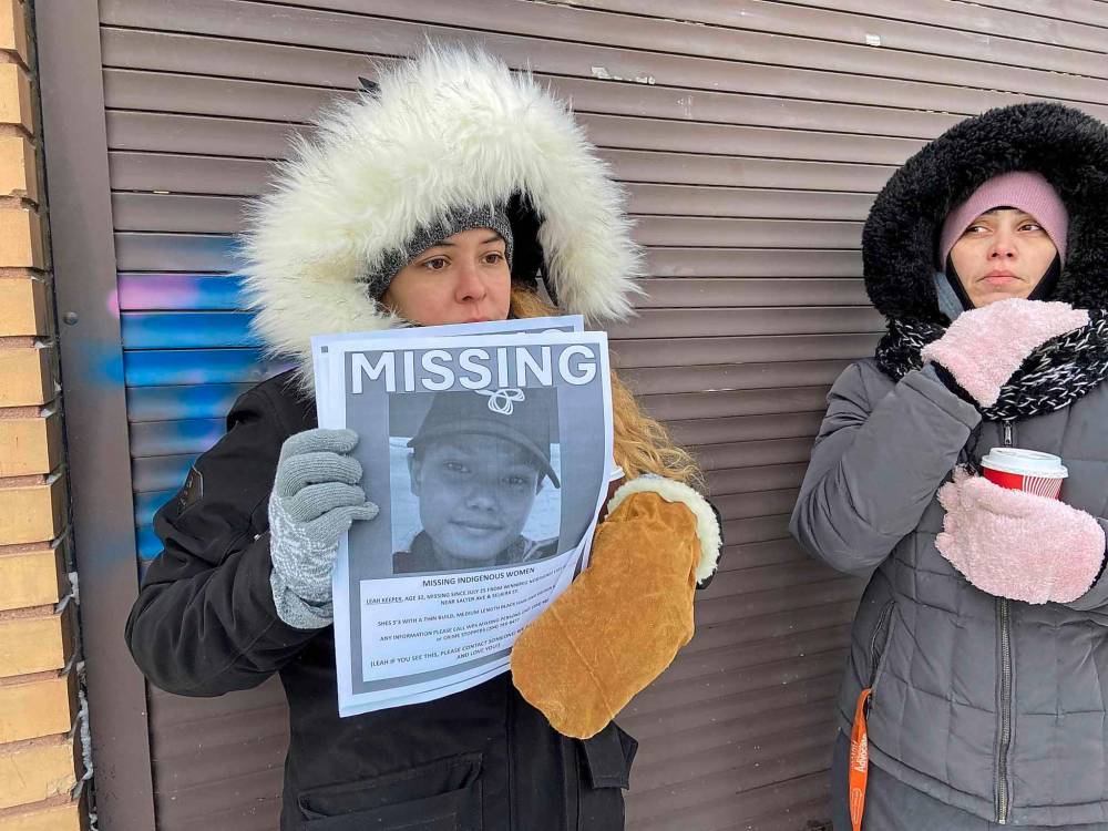 Katie Thompson is part of a group chat sharing information on Leah Keeper’s disappearance. She handed out flyers Saturday. (Malak Abas / Winnipeg Free Press)
