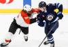Philadelphia Flyers’ Marc Staal defends against Winnipeg’s Rasmus Kupari (right) during action in Winnipeg, Saturday night. (John Woods / The Canadian Press)