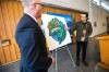Mayor Scott Gillingham (left) and artist Jordan Stranger speak about the symbolism in the Winnipeg 150 graphic after revealing it at City Hall on Monday. (Mikaela MacKenzie / Winnipeg Free Press)