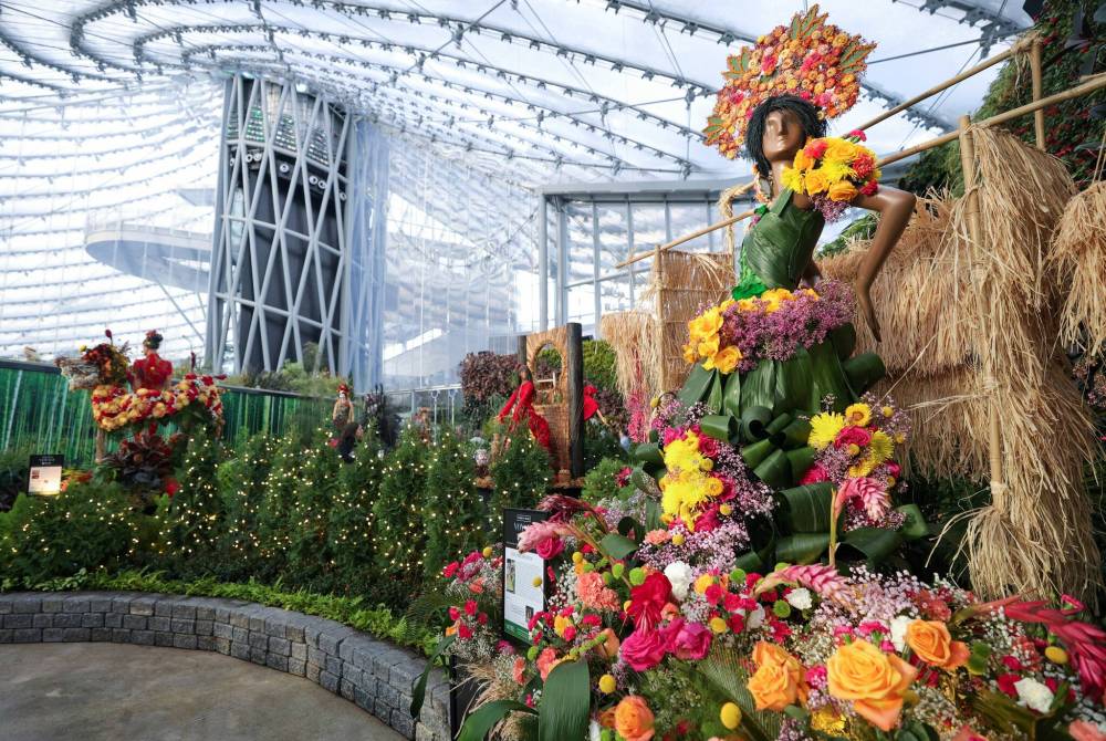 Juliet Cadiz of Posh Pampas highlighted the Pahiyas 
Festival in the Philippines. It is one of 15 one-of-a-kind floral mannequins inspired by global travel destinations created by local florists using fresh flowers and other natural plant material. (Ruth Bonneville / Winnipeg Free Press)