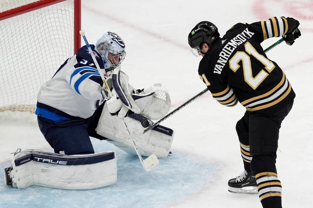 (AP Photo/Michael Dwyer)
Winnipeg Jets goalie Connor Hellebuyck stops a shot by Boston Bruins’ James van Riemsdyk during the second period.