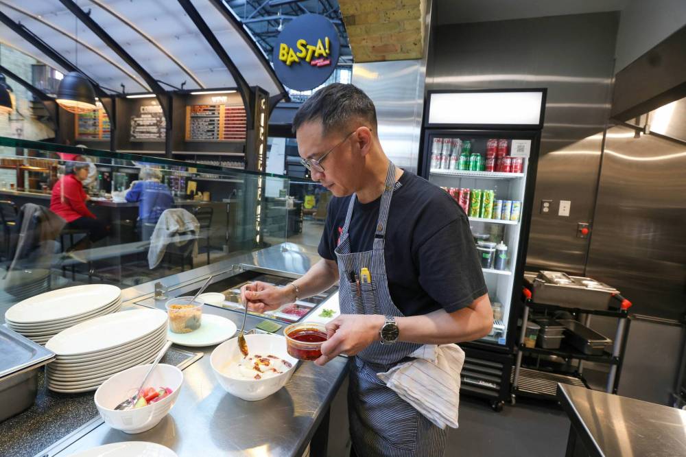 RUTH BONNEVILLE / WINNIPEG FREE PRESS
                                Chef Norm Pastorin in his dream kitchen at the Forks food court.