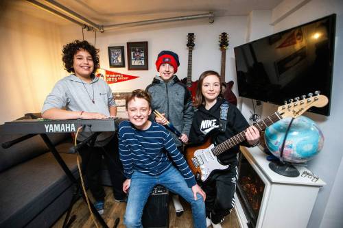 MIKAELA MACKENZIE / WINNIPEG FREE PRESS
                                Sebi Zurzolo (left, 11), Bennett Erum-Rieger (11), Sal Tait (11), and Madis Paas (11), who make up the band We&rsquo;re Only Here for the Snacks, in their rehearsal space.