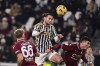 Salernitana's Matteo Lovato, left, and Juventus' Adrien Rabiot battle for the ball during the Italian Cup soccer match between Juventus and Salernitana at the Juventus Stadium in Turin, Italy, Thursday, Jan. 4, 2024. (Marco Alpozzi/dpa via AP)