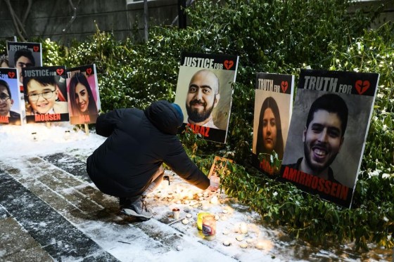 Members of the Iranian community gather and grieve on the fourth anniversary of the downing of Ukraine International Airlines Flight PS752, in Toronto on Sunday. (Christopher Katsarov / The Canadian Press)