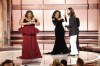 This image released by CBS shows host Da'Vine Joy Randolph, left, accepting the award for best female supporting actor in a motion picture for her role in 
