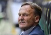 FILE - Borussia Dortmund CEO Hans Joachim Watzke sits on the bench prior the German Bundesliga soccer match between Borussia Moenchengladbach and Borussia Dortmund in Moenchengladbach, Germany, Saturday, May 18, 2019. Borussia Dortmund chief executive Hans-Joachim 