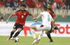 FILE - Egypt's Mohamed Salah, left, and Morocco's Nayef Aguerd challenge for the ball during the African Cup of Nations 2022 quarter-final soccer match between Egypt and Morocco at the Ahmadou Ahidjo stadium in Yaounde, Cameroon, on Jan. 30, 2022. (AP Photo/Sunday Alamba)