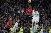 Mallorca's Jose Manuel Copete jumps for the ball with Real Madrid's Federico Valverde during the Spanish La Liga soccer match between Real Madrid and Mallorca at the Santiago Bernabeu stadium in Madrid, Spain, on Wednesday, January 3, 2024. (AP Photo/Bernat Armangue)
