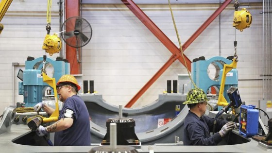 Two workers assembling key wind turbine components at the GE Vernova manufacturing facility in Pensacola, Fla. (Rebecca Shurtleff / GE Vernova via The Associated Press files)