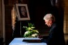 Munich's Lord Mayor Dieter Reiter signs the book of condolence for the late Franz Beckenbauer in Munich, Germany, Tuesday, Jan. 9, 2024. Germany's World Cup-winning coach Franz Beckenbauer has died. He was 78. Beckenbauer's family issued a statement to news agency dpa saying that Beckenbauer “passed away peacefully in his sleep yesterday, Sunday Jan. 7, 2024, surrounded by his family.” (Lennart Preiss/dpa via AP)