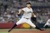 FILE -Japan pitcher Shota Imanaga (21) throws during first inning of a World Baseball Classic championship game against the United States, Tuesday, March 21, 2023, in Miami. The Chicago Cubs bolstered their rotation Tuesday, Jan. 9, 2024, agreeing to a contract with Japanese left-hander Shōta Imanaga in their first major offseason roster move.(AP Photo/Wilfredo Lee, File)