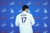Los Angeles Dodgers' Shohei Ohtani leaves the stage after a baseball news conference at Dodger Stadium Thursday, Dec. 14, 2023, in Los Angeles. (AP Photo/Ashley Landis)