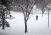 The City of Calgary has announced plans to help keep homeless people safe during extreme cold weather. A person walks along a snow-covered path at the University of Calgary in Calgary, Alta., Monday, Nov. 7, 2022. THE CANADIAN PRESS/Jeff McIntosh