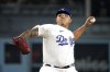 FILE - Los Angeles Dodgers starting pitcher Julio Urias throws to the plate during the first inning of a baseball game against the Atlanta Braves Friday, Sept. 1, 2023, in Los Angeles. Former Los Angeles Dodgers pitcher Julio Urías won’t be charged with a felony after his arrest in September on suspicion of domestic violence. (AP Photo/Mark J. Terrill, File)