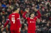 Liverpool's Curtis Jones, right, celebrates after scoring his side's opening goal during the EFL Cup first leg semi final soccer match between Liverpool and Fulham at Anfield stadium in Liverpool, England, Wednesday, Jan. 10, 2024. (AP Photo/Jon Super)