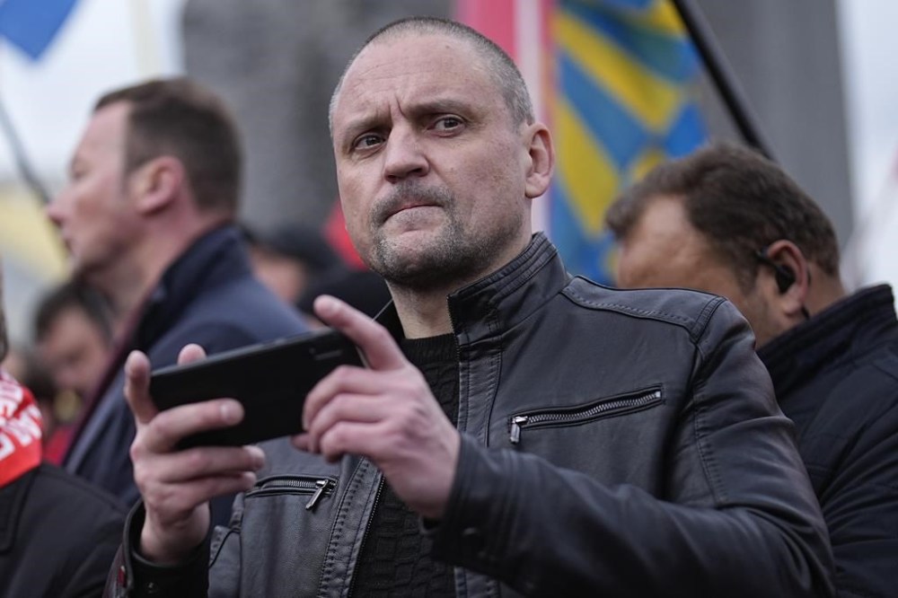 Sergei Udaltsov, Russian left-wing political activist attends a rally of communists party supporters marking the 106th anniversary of the 1917 Bolshevik revolution near Red Square, in Moscow, Russia, on Tuesday, Nov. 7, 2023. Russian left-wing activist Sergei Udaltsov has been charged with justifying terrorism on social media, the state-run news agency RIA Novosti reported. (AP Photo/Alexander Zemlianichenko)