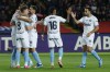 FILE - Girona's Artem Dovbyk, left, celebrates with teammates during the Spanish La Liga soccer match between Barcelona and Girona at the Olimpic Lluis Companys stadium in Barcelona, Spain, Sunday, Dec. 10, 2023. While Real Madrid vies for the Spanish Super Cup in Saudi Arabia, Girona has its chance to move ahead of the heavy favorite in their Spanish league title chase. Girona aims to keep up its superb season that has stunned rivals and far exceeded expectations when it visits lowly Almeria to start the second half of the league season on Sunday. (AP Photo/Joan Monfort, File)