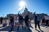 People attend a rally opposing the Saskatchewan government's proposed legislation on its pronoun policy in front of the Saskatchewan Legislative Building in Regina, Tuesday, Oct. 10, 2023. THE CANADIAN PRESS/Heywood Yu