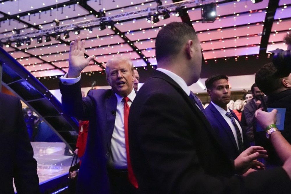Republican presidential candidate former President Donald Trump waves after a Fox News Channel town hall in Des Moines, Iowa, Wednesday, Jan. 10, 2024. (AP Photo/Carolyn Kaster)