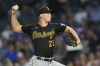 FILE - Pittsburgh Pirates starting pitcher Mitch Keller delivers during the first inning of a baseball game against the Chicago Cubs, Sept. 20, 2023, in Chicago. Keller agreed to terms on a one-year deal with the Pirates, Thursday, Jan. 11, 2024, to avoid arbitration. (AP Photo/Charles Rex Arbogast, File)