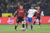 Osasuna's Ante Budimir, left, fights for the ball with Barcelona's Sergi Roberto during the Spanish Super Cup semi final soccer match between Osasuna and Barcelona at Al Awal Park Stadium in Riyadh, Saudi Arabia, Thursday, Jan. 11, 2024. (AP Photo)