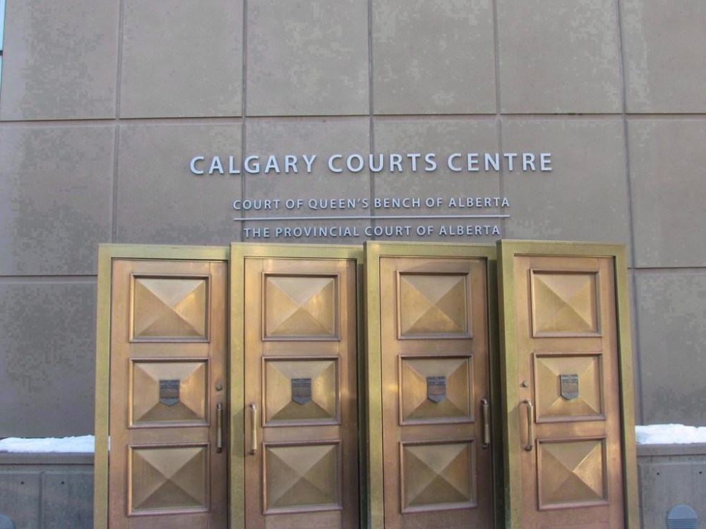 A man accused of kidnapping and sexually assaulting five women in Calgary is to have a French-language trial, which is relatively uncommon in the Alberta Court of Justice but legally required if requested. The sign at the Calgary Courts Centre in Calgary is shown on Jan. 5, 2018. THE CANADIAN PRESS/Bill Graveland