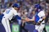 Toronto Blue Jays relief pitcher Jordan Romano (68), left, celebrates with teammate catcher Alejandro Kirk (30) after defeating the Houston Astros in American League MLB baseball action in Toronto on Wednesday, June 7, 2023. The Toronto Blue Jays say they have signed deals with 11 players, including Cavan Biggio, Alejandro Kirk and closer Jordan Romano, for 2024.THE CANADIAN PRESS/Andrew Lahodynskyj