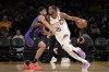 Phoenix Suns forward Kevin Durant, right, drives past Los Angeles Lakers guard Max Christie during the first half of an NBA basketball game Thursday, Jan. 11, 2024, in Los Angeles. (AP Photo/Mark J. Terrill)