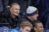 Manchester City's Erling Haaland, left, looks out from the bench prior the English FA Cup third round soccer match between Manchester City and Huddersfield Town, at the Etihad stadium in Manchester, England, Sunday, Jan. 7, 2024. (AP Photo/Dave Thompson)