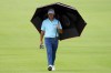 Brian Harman walks up the ninth fairway in the rain during the second round of the Sony Open golf event, Friday, Jan. 12, 2024, at Waialae Country Club in Honolulu. (AP Photo/Matt York)
